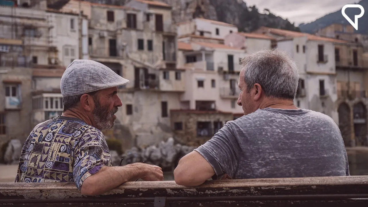 Two Italian men talking outside